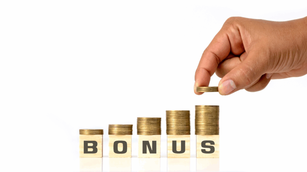 bonusと書かれた木のブロックの上に積まれている金貨